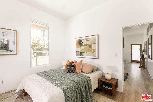 a bedroom with bed and a window