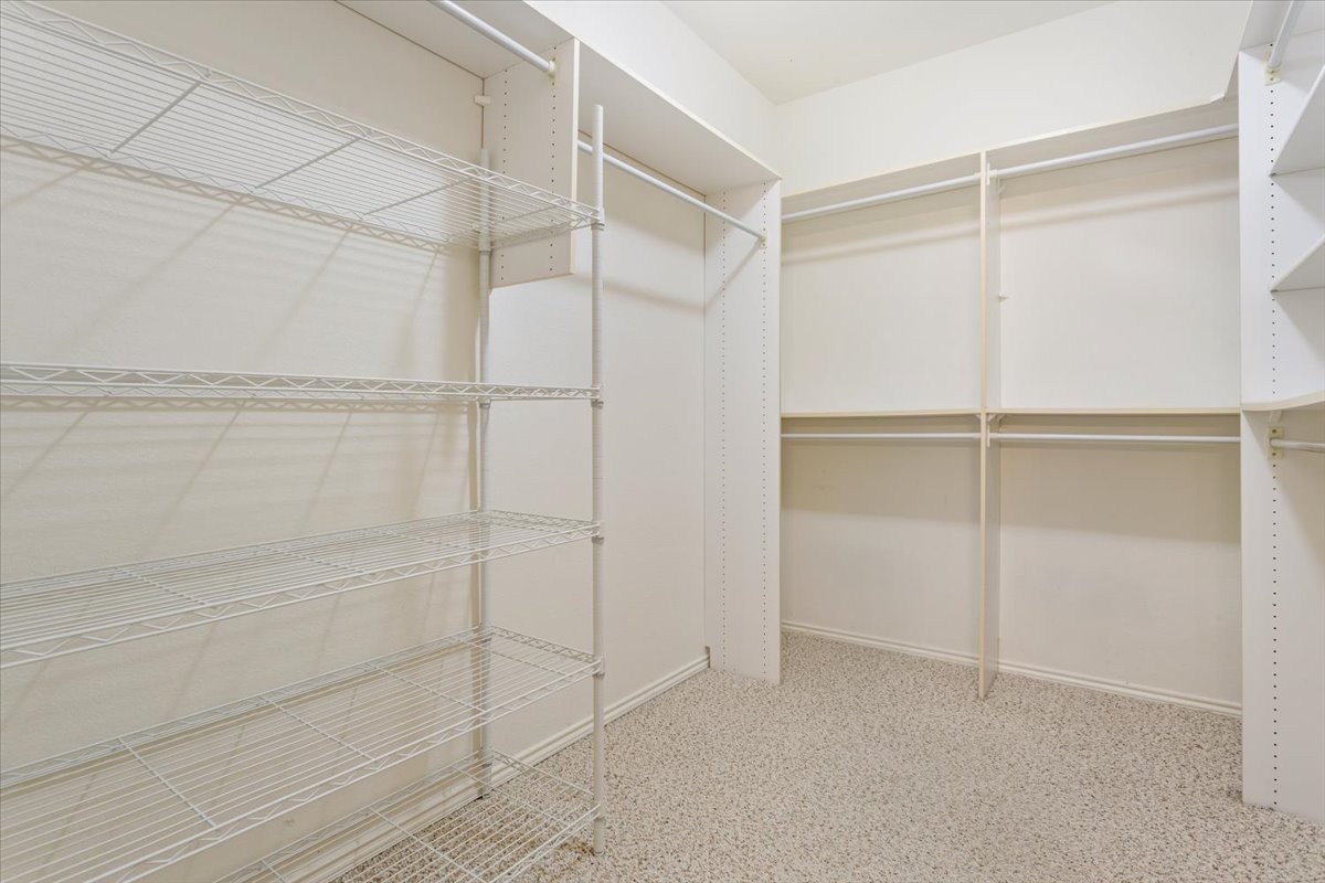 246 Red Poppy Trail Georgetown, TX 78633 - Photo 23 of 32 a view of an empty walk in closet