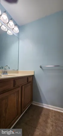 a white toilet sitting next to a bath tub and a shower