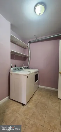 a view of an empty room with a fireplace