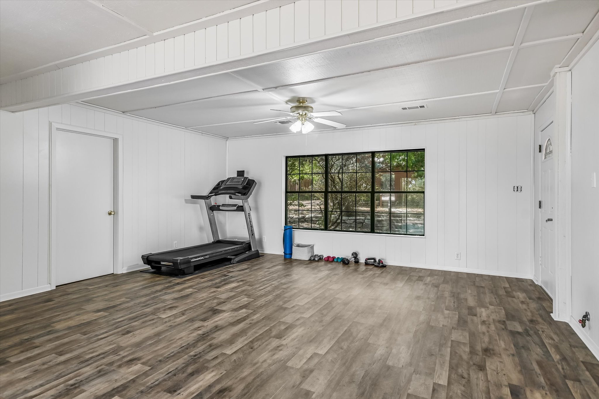 175 Fischer Trail Wimberley, TX 78676 - Photo 13 of 31 a view of a room with gym equipment and a large window
