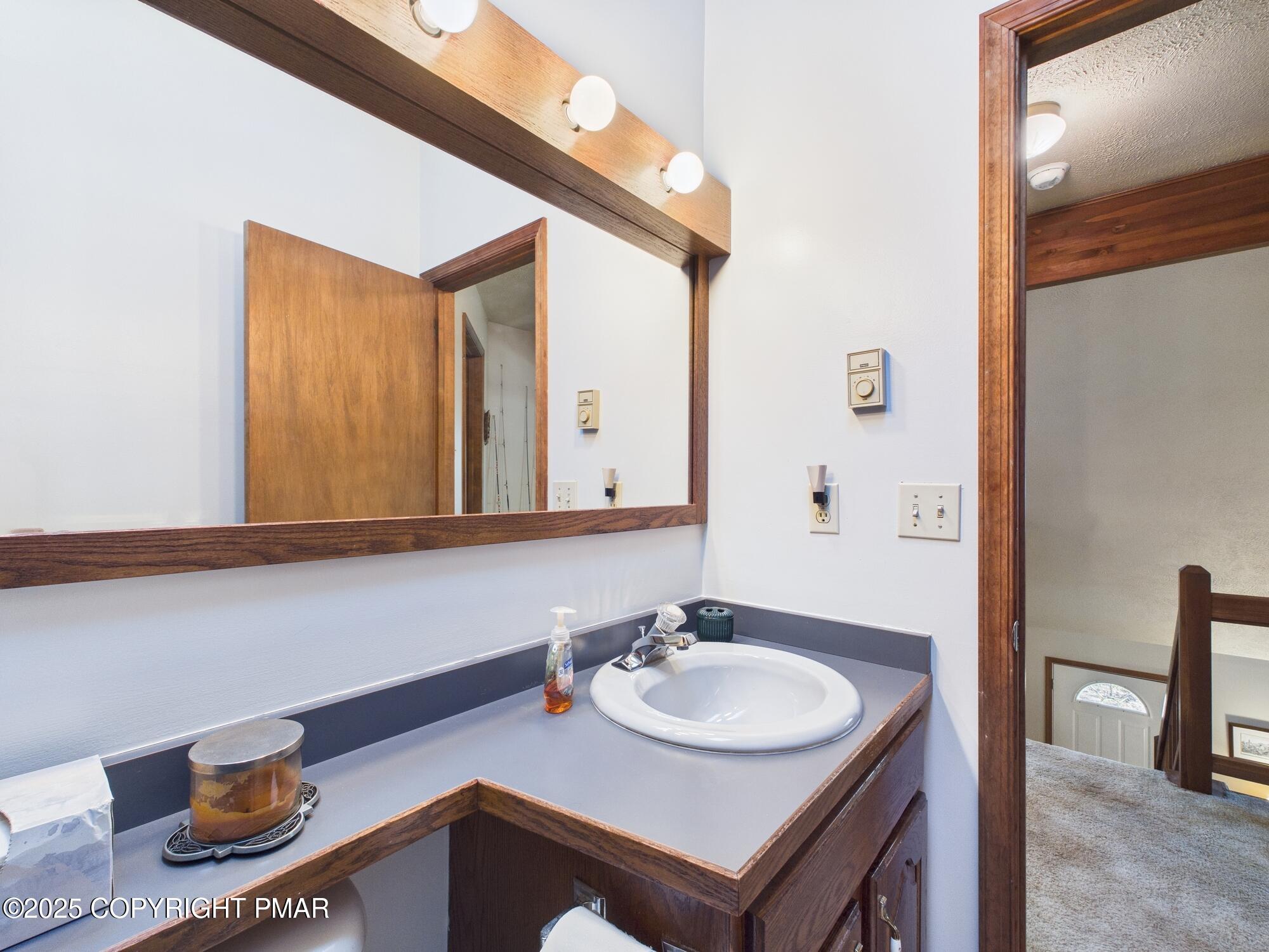 266 King Arthur Road Pocono Lake, PA 18347 - Photo 22 of 26 a bathroom with a sink and a mirror
