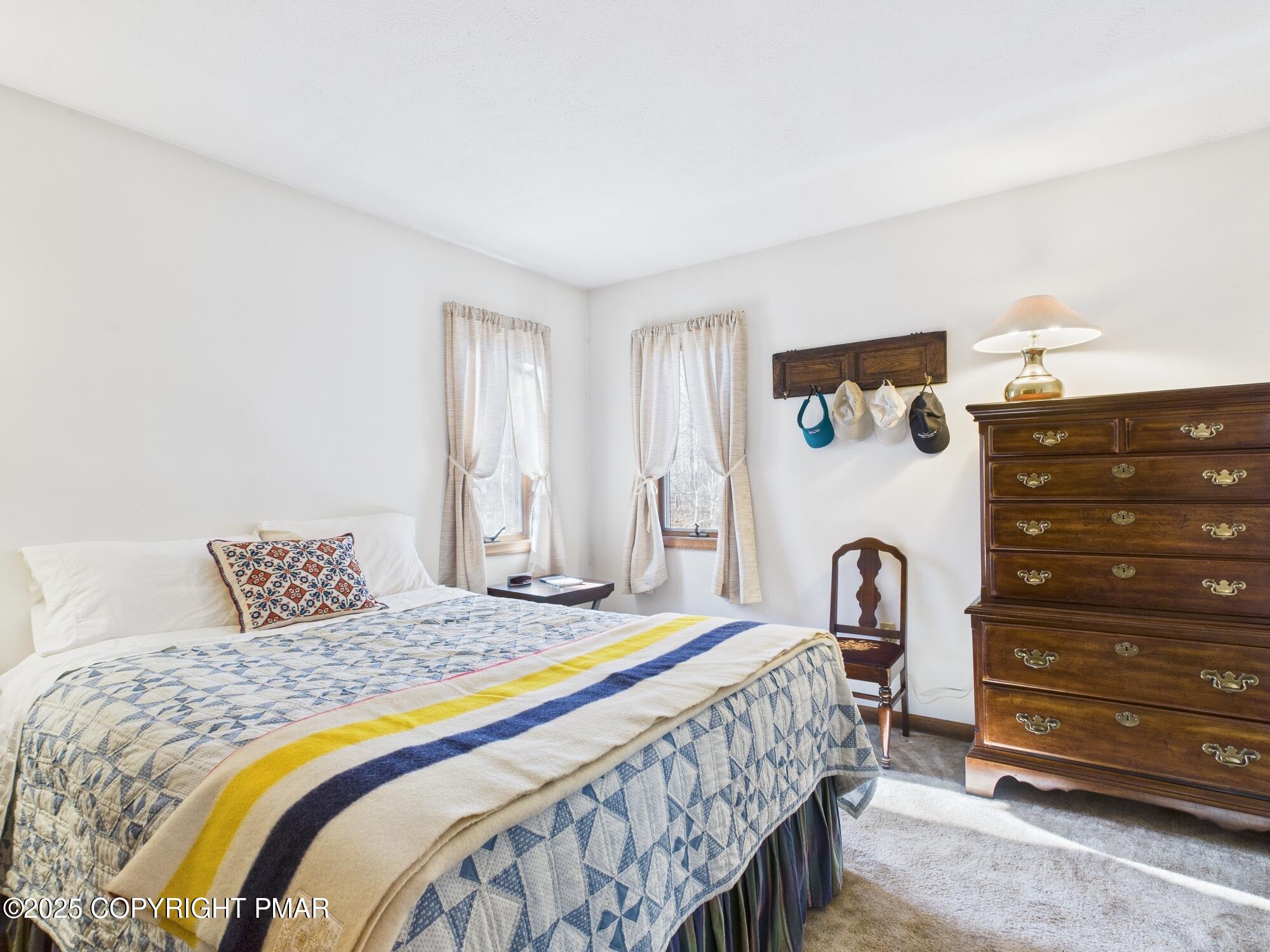 266 King Arthur Road Pocono Lake, PA 18347 - Photo 23 of 26 a bedroom with a bed and a dresser