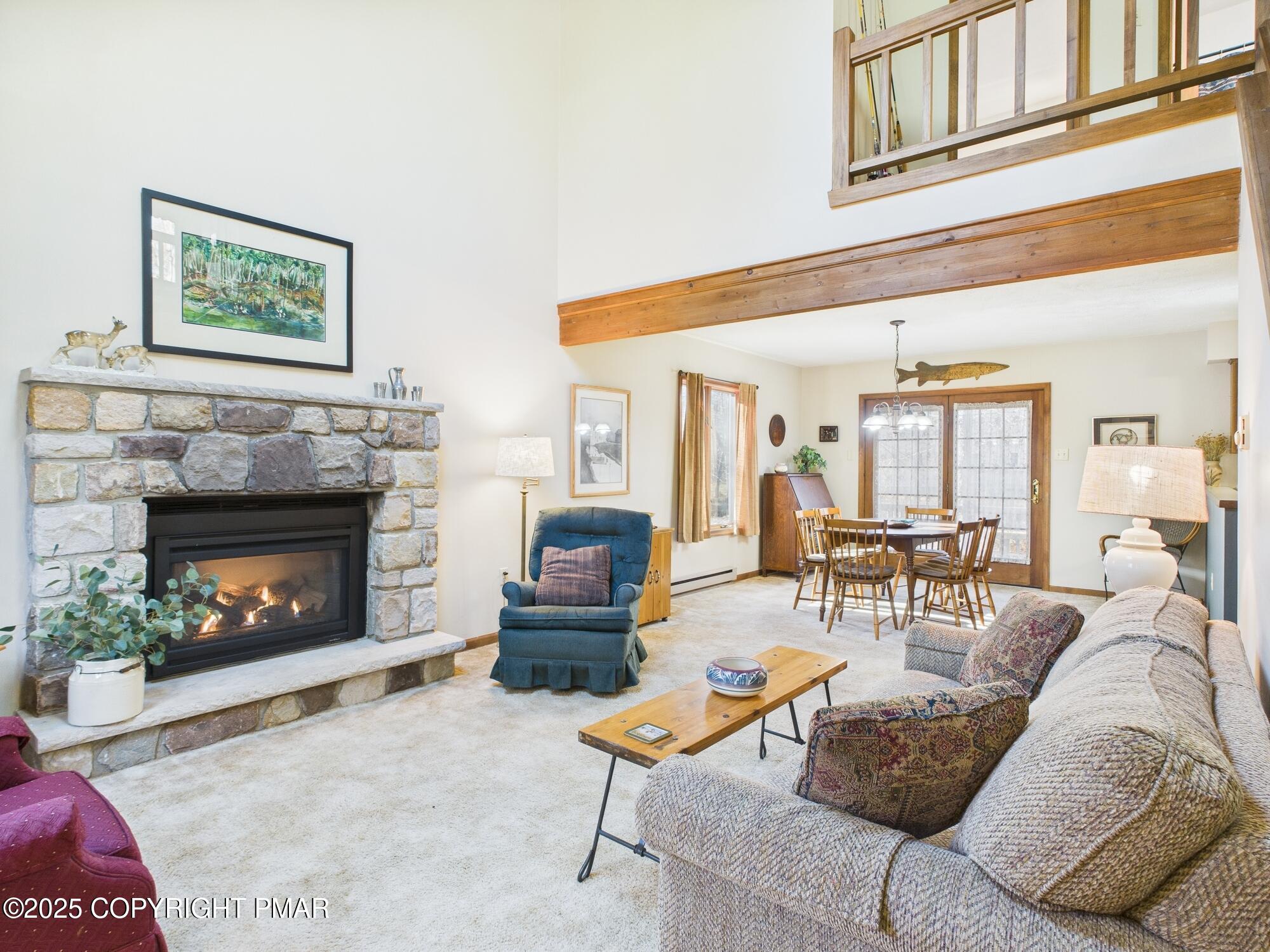 266 King Arthur Road Pocono Lake, PA 18347 - Photo 3 of 26 a living room with furniture and a fireplace