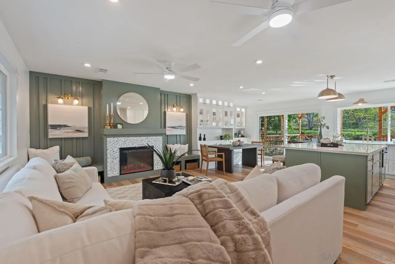1155 Pepper Drive El Cajon, CA 92021 - Photo 1 of 62 a living room with furniture a fireplace and a large window