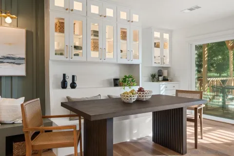 a kitchen with a table and chairs in it