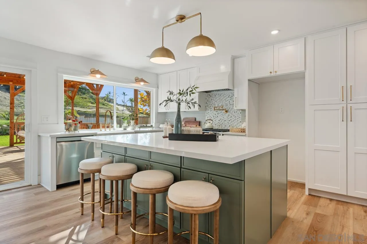 1155 Pepper Drive El Cajon, CA 92021 - Photo 14 of 62 a kitchen with a table and chairs in it