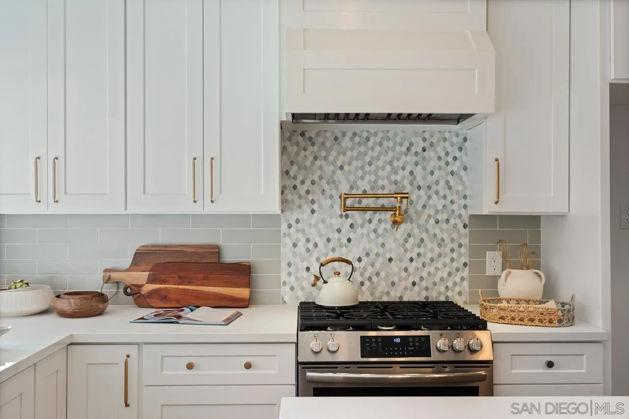 1155 Pepper Drive El Cajon, CA 92021 - Photo 17 of 62 a stove top oven sitting inside of a kitchen