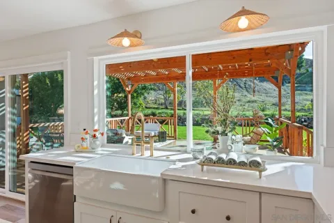 a view of a dining table and chairs in the kitchen