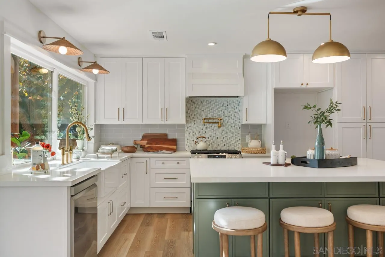 1155 Pepper Drive El Cajon, CA 92021 - Photo 19 of 62 a kitchen with a table and chairs in it