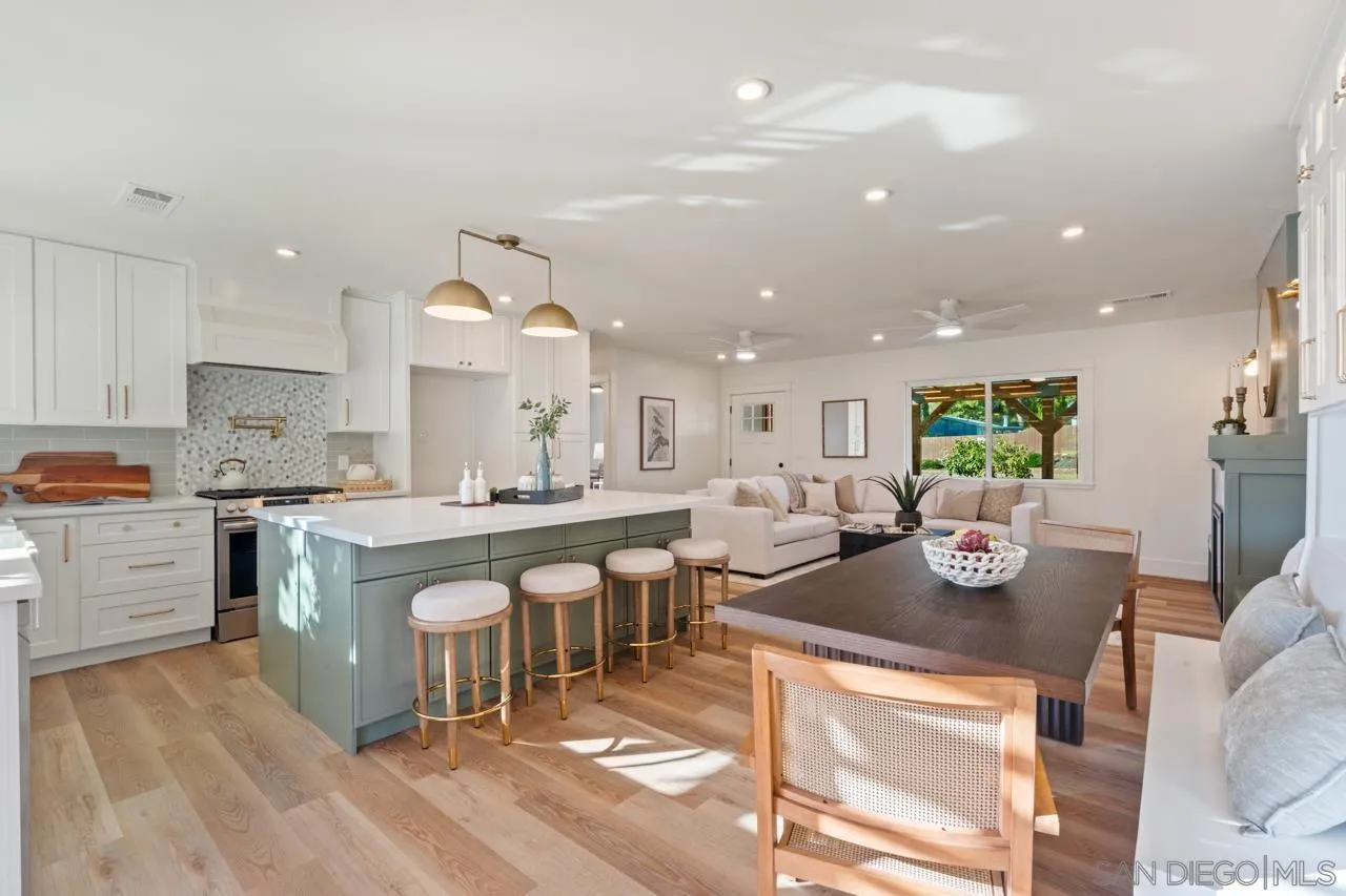 1155 Pepper Drive El Cajon, CA 92021 - Photo 20 of 62 a large kitchen with a table and chairs in it