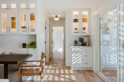 a bathroom with a sink and two mirror