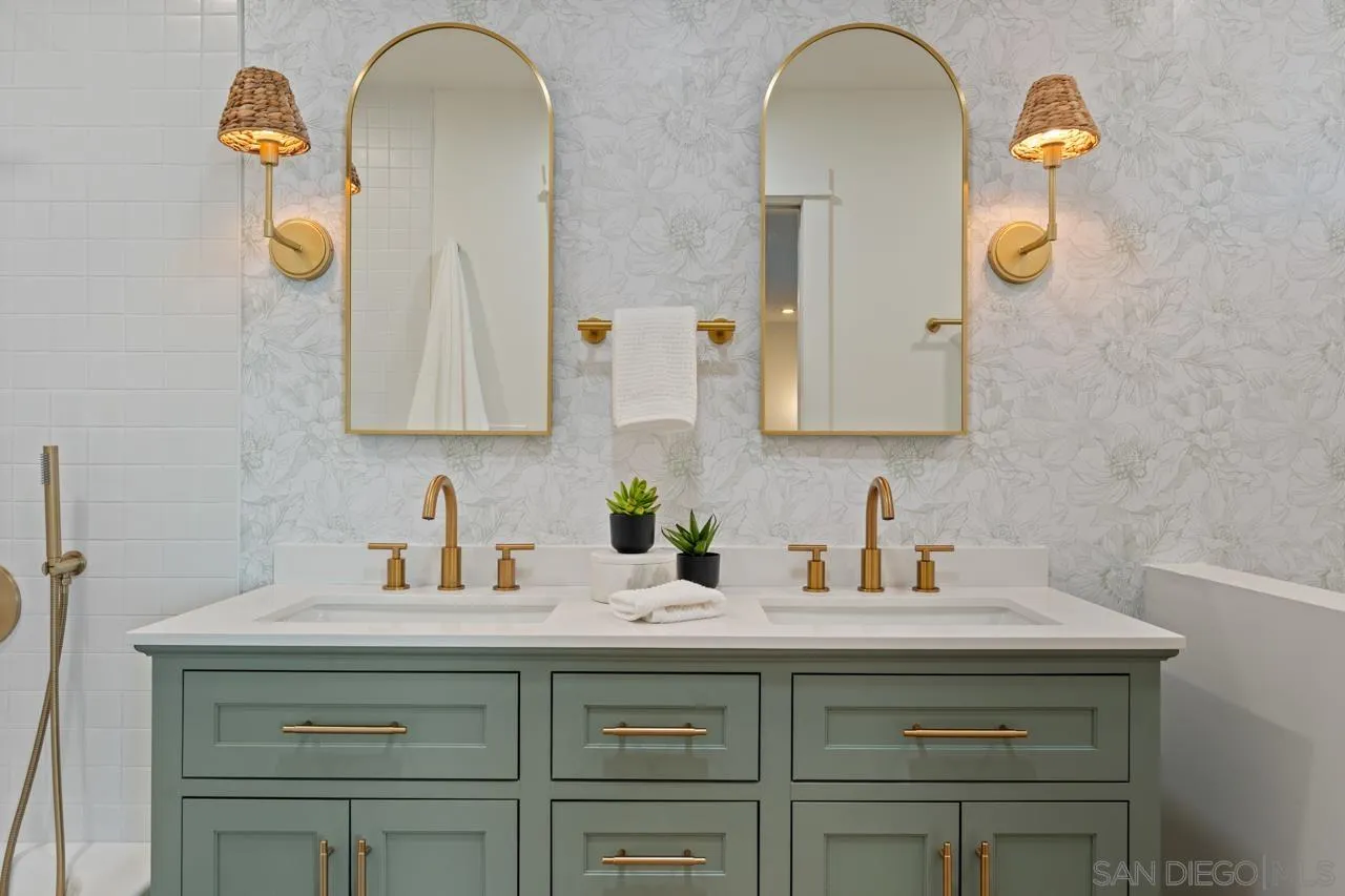 1155 Pepper Drive El Cajon, CA 92021 - Photo 24 of 62 a bathroom with a sink and two mirror