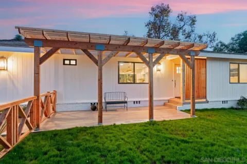 a view of porch with furniture and garden