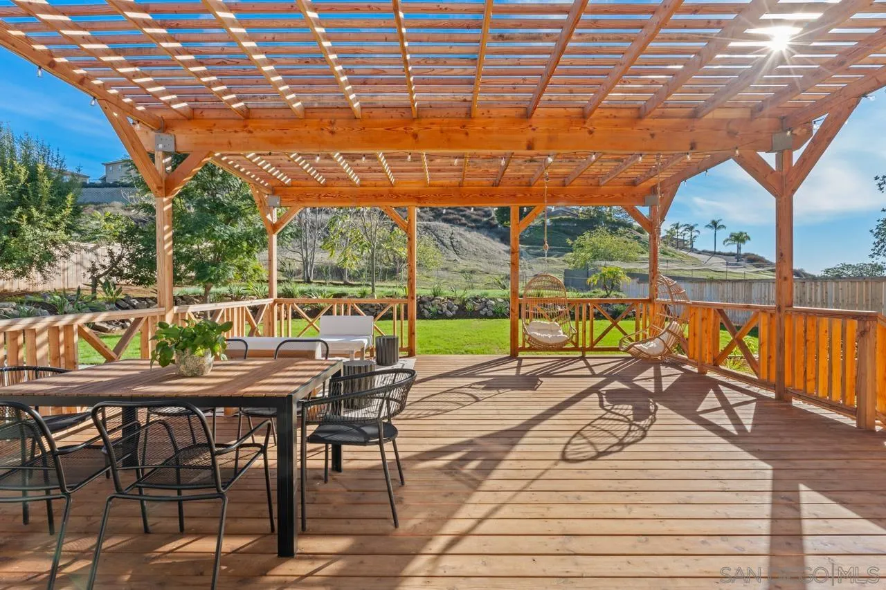 1155 Pepper Drive El Cajon, CA 92021 - Photo 45 of 62 a view of a patio with a table chairs and garden
