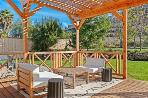 a kitchen with a table chairs stove and cabinets
