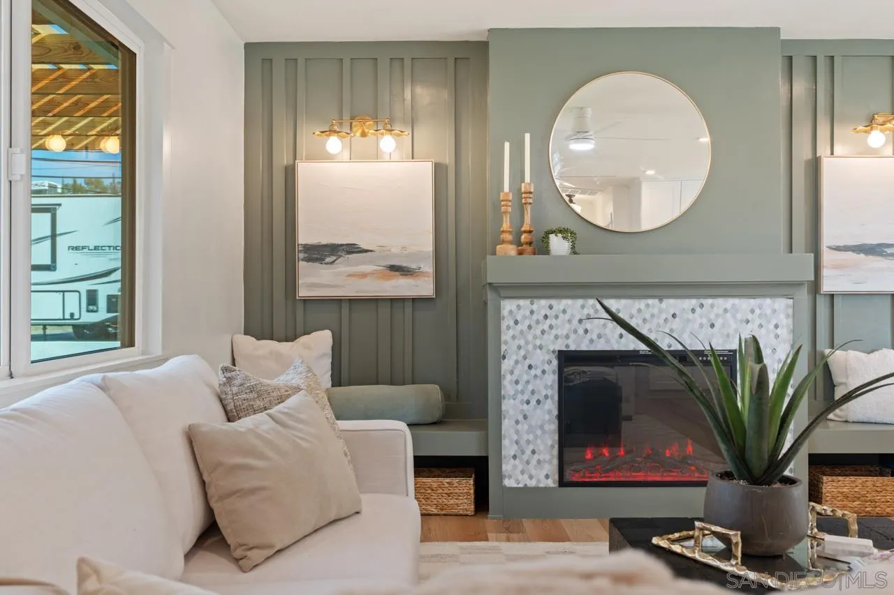 1155 Pepper Drive El Cajon, CA 92021 - Photo 54 of 62 a living room with furniture a fireplace and a potted plant