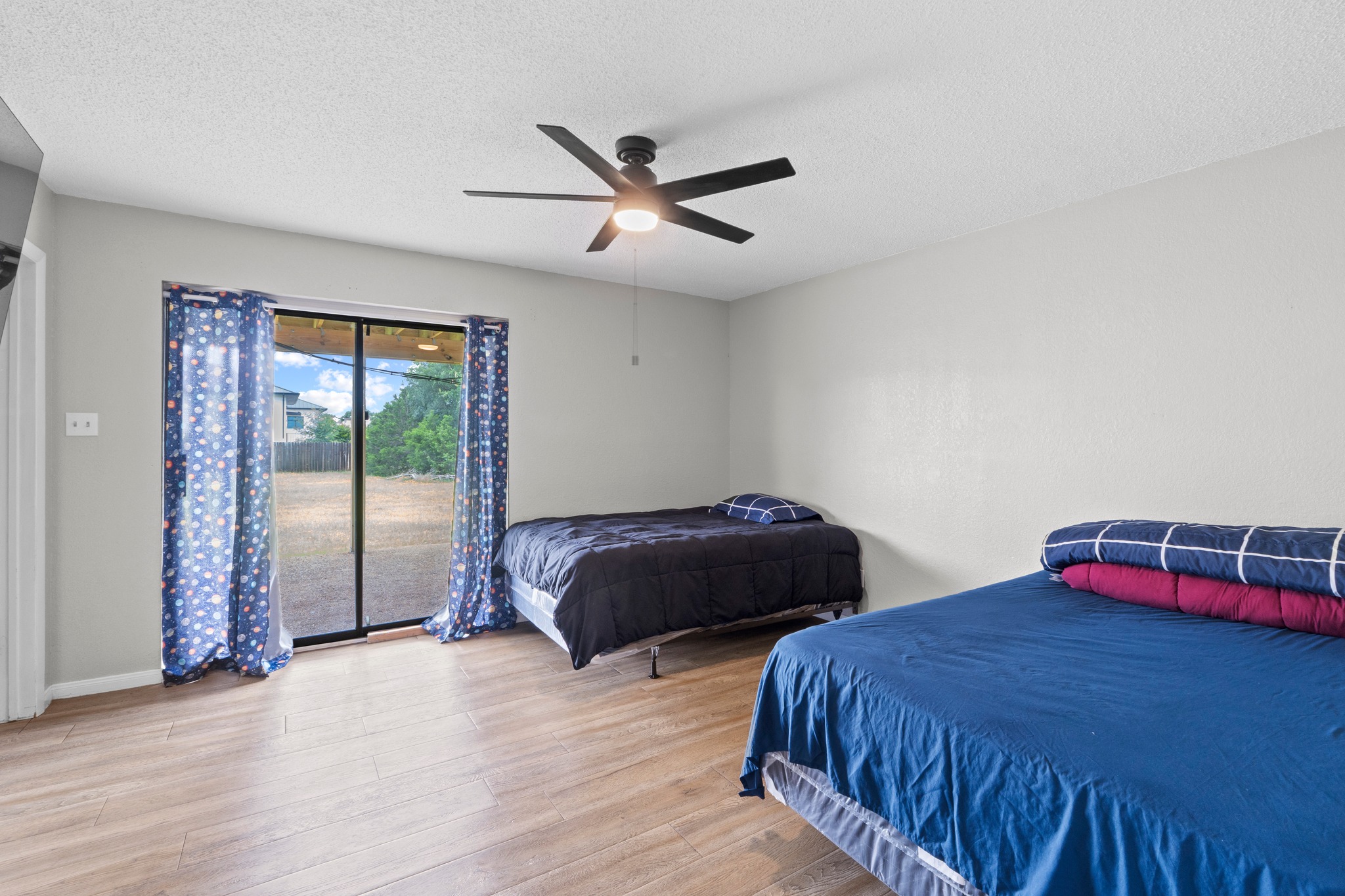 205 Sedro Trail Georgetown, TX 78633 - Photo 20 of 32 Bright bedroom with warm flooring and direct access to the private yard.