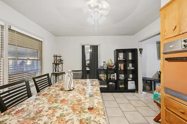 a kitchen with stainless steel appliances kitchen island granite countertop a refrigerator and cabinets