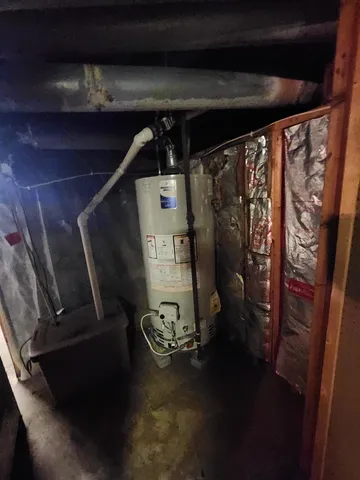 a view of a house with a yard and large trees