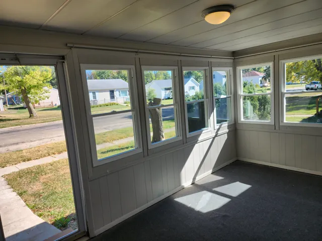 a view of yard with tree in front of it