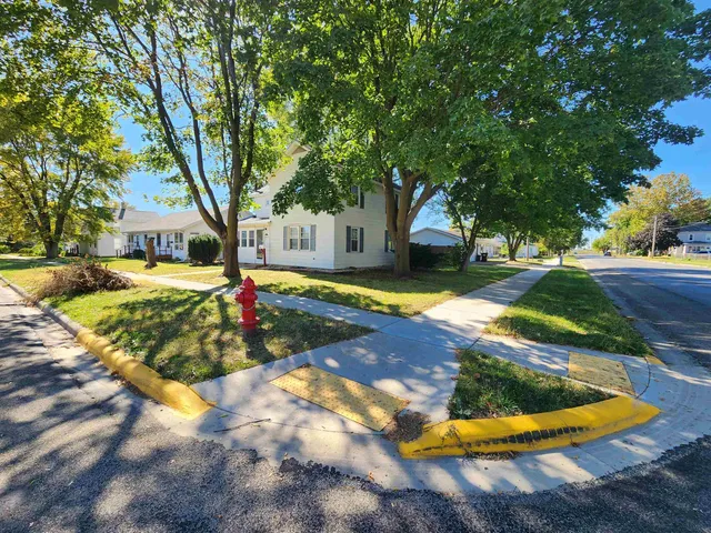 a bathroom with a glass shower door and a mirror