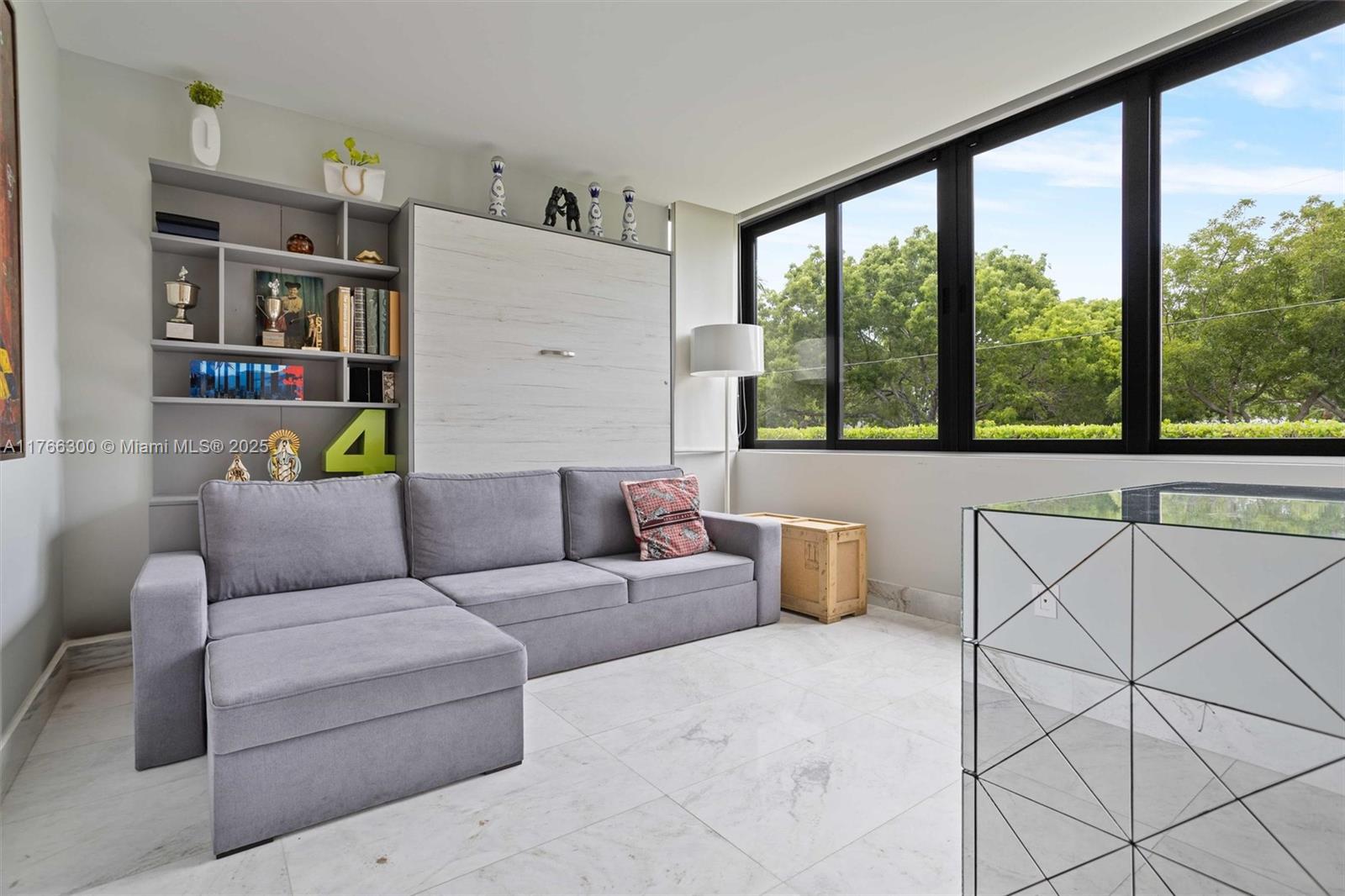 610 Harbor Circle Key Biscayne, FL 33149 - Photo 21 of 71 a living room with furniture and a floor to ceiling window