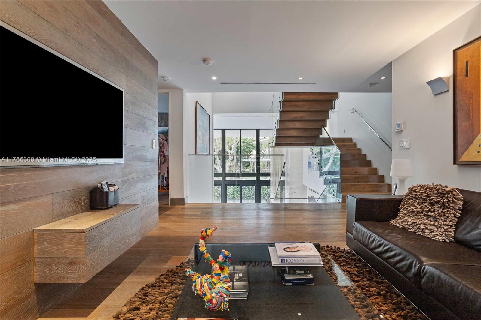 610 Harbor Circle Key Biscayne, FL 33149 - Photo 24 of 71 a living room with furniture and a flat screen tv