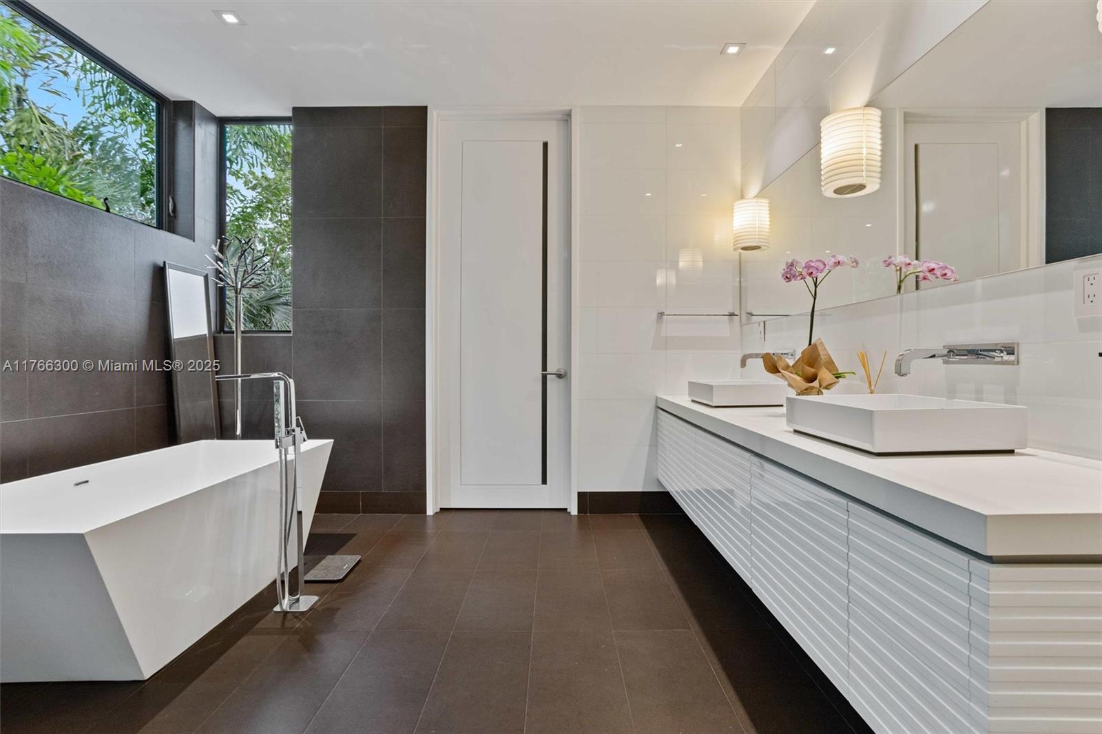 610 Harbor Circle Key Biscayne, FL 33149 - Photo 31 of 71 a bathroom with a sink a toilet and shower