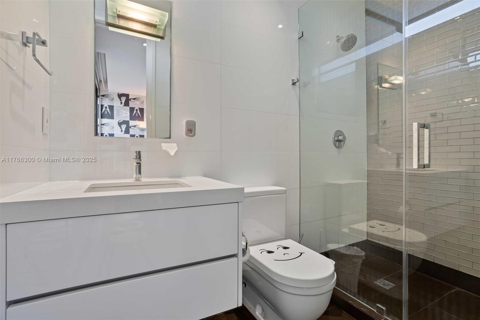 610 Harbor Circle Key Biscayne, FL 33149 - Photo 38 of 71 a bathroom with a sink toilet and shower