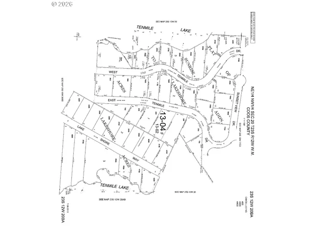 a blue and white umbrella sitting in front of a house