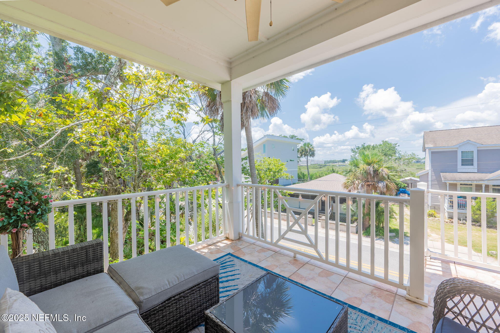 239 Riberia Street St. Augustine, FL 32084 - Photo 15 of 88 a view of a chair and tables in the balcony