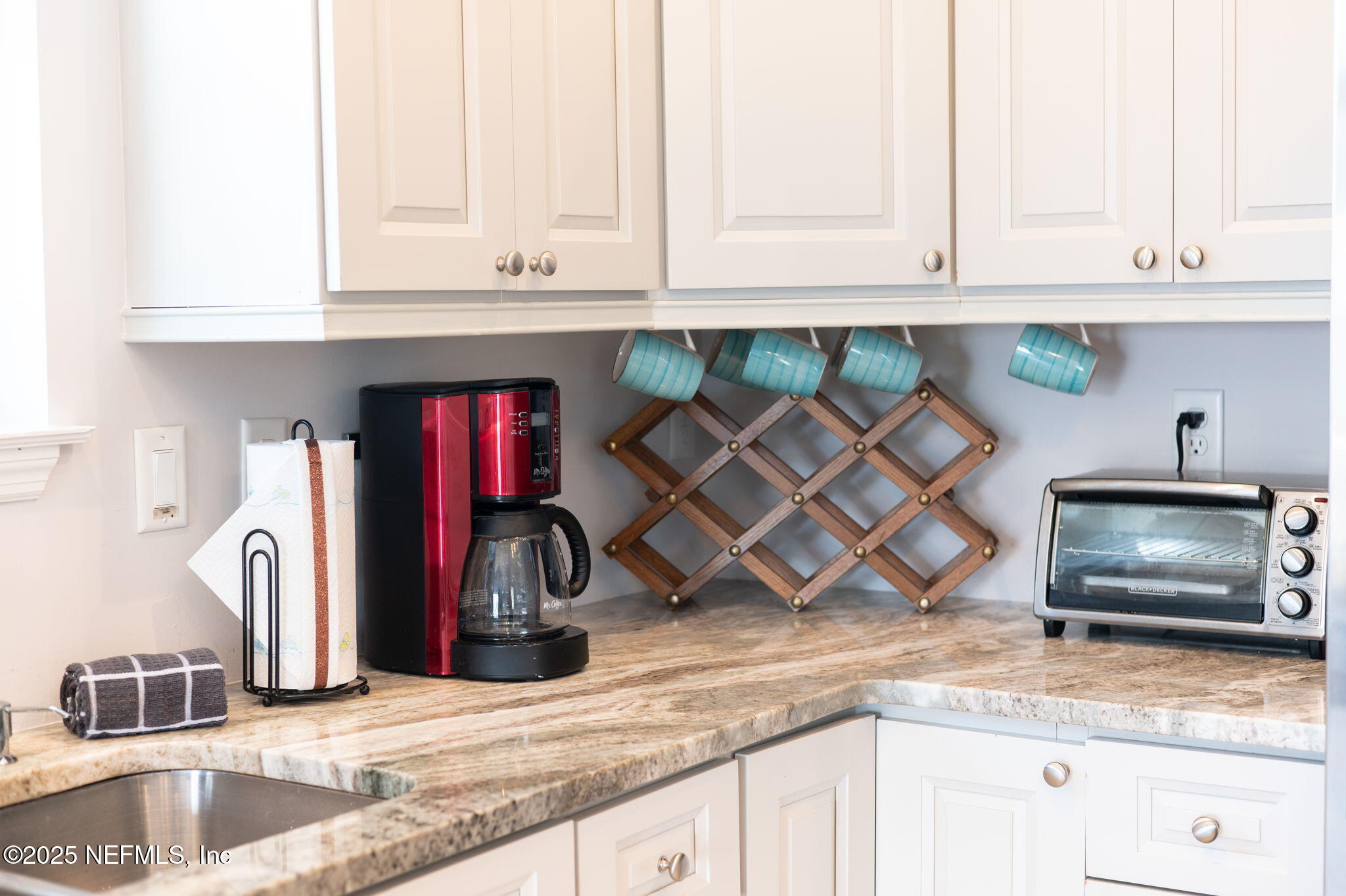 239 Riberia Street St. Augustine, FL 32084 - Photo 18 of 88 a kitchen with granite countertop a sink a stove and cabinets