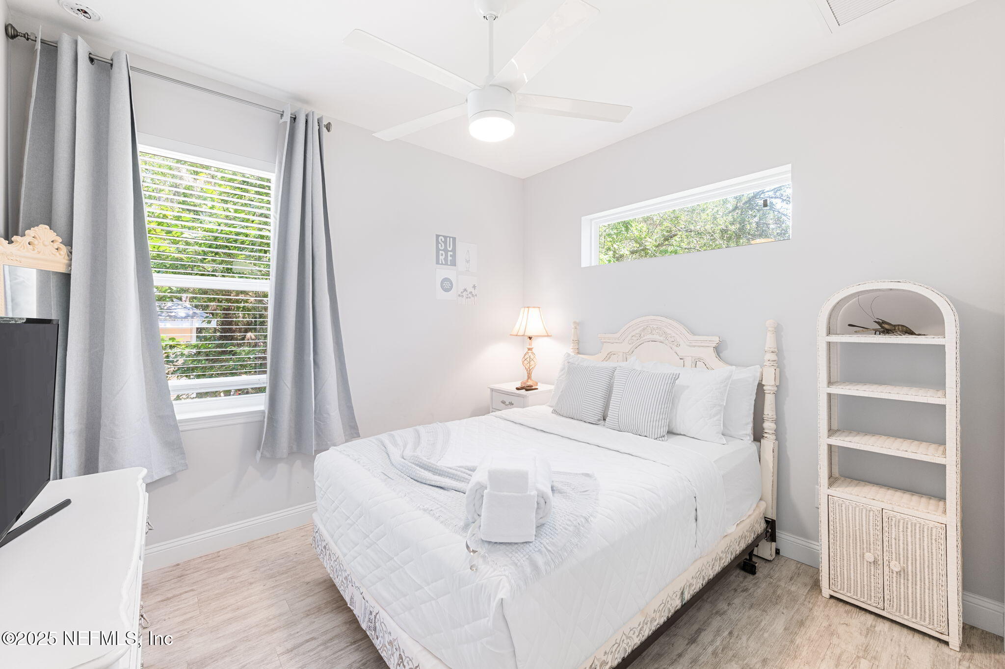 239 Riberia Street St. Augustine, FL 32084 - Photo 33 of 88 a bedroom with a white bed and a window