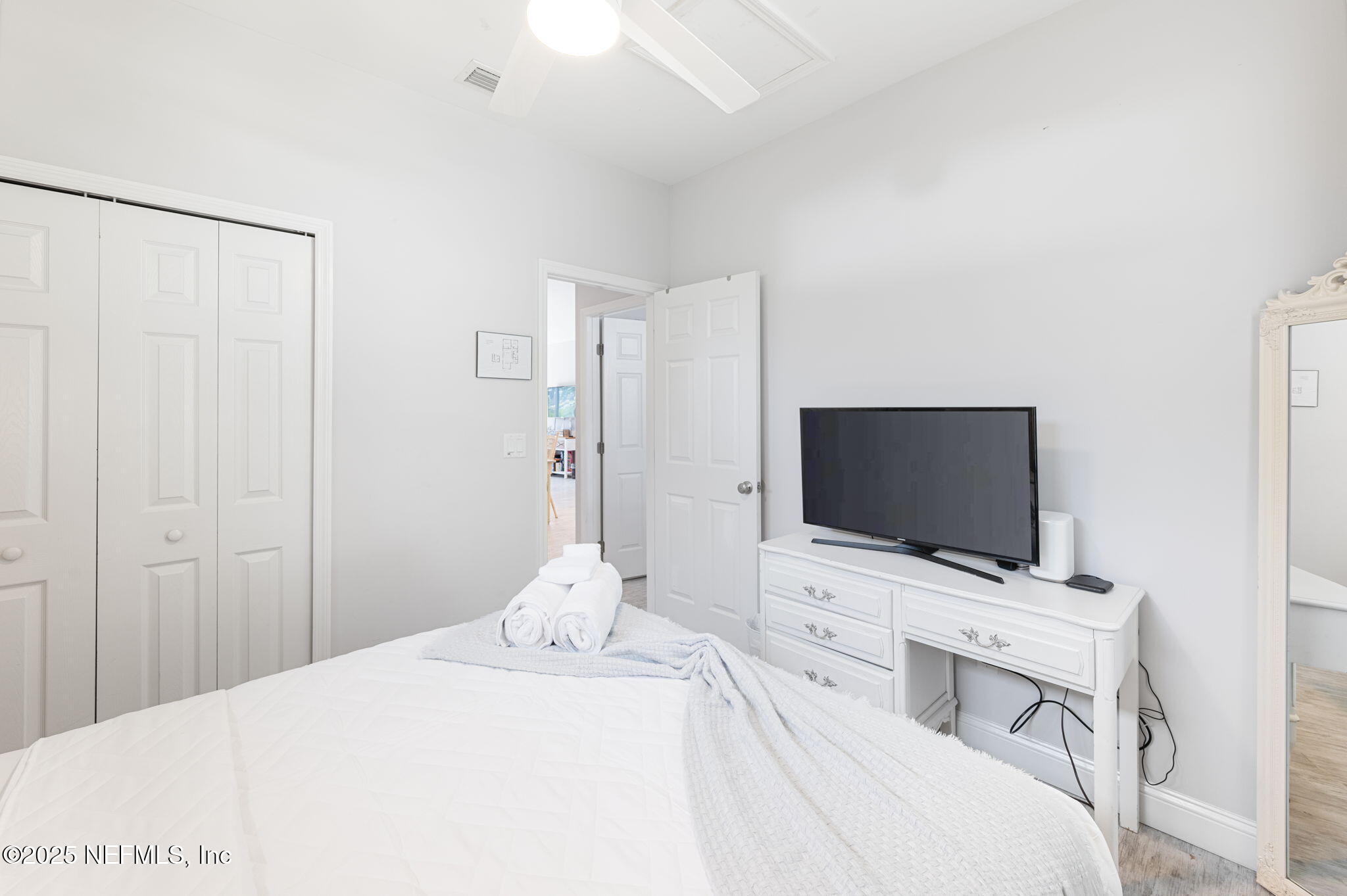 239 Riberia Street St. Augustine, FL 32084 - Photo 36 of 88 a hotel room with a bed and a flat screen tv