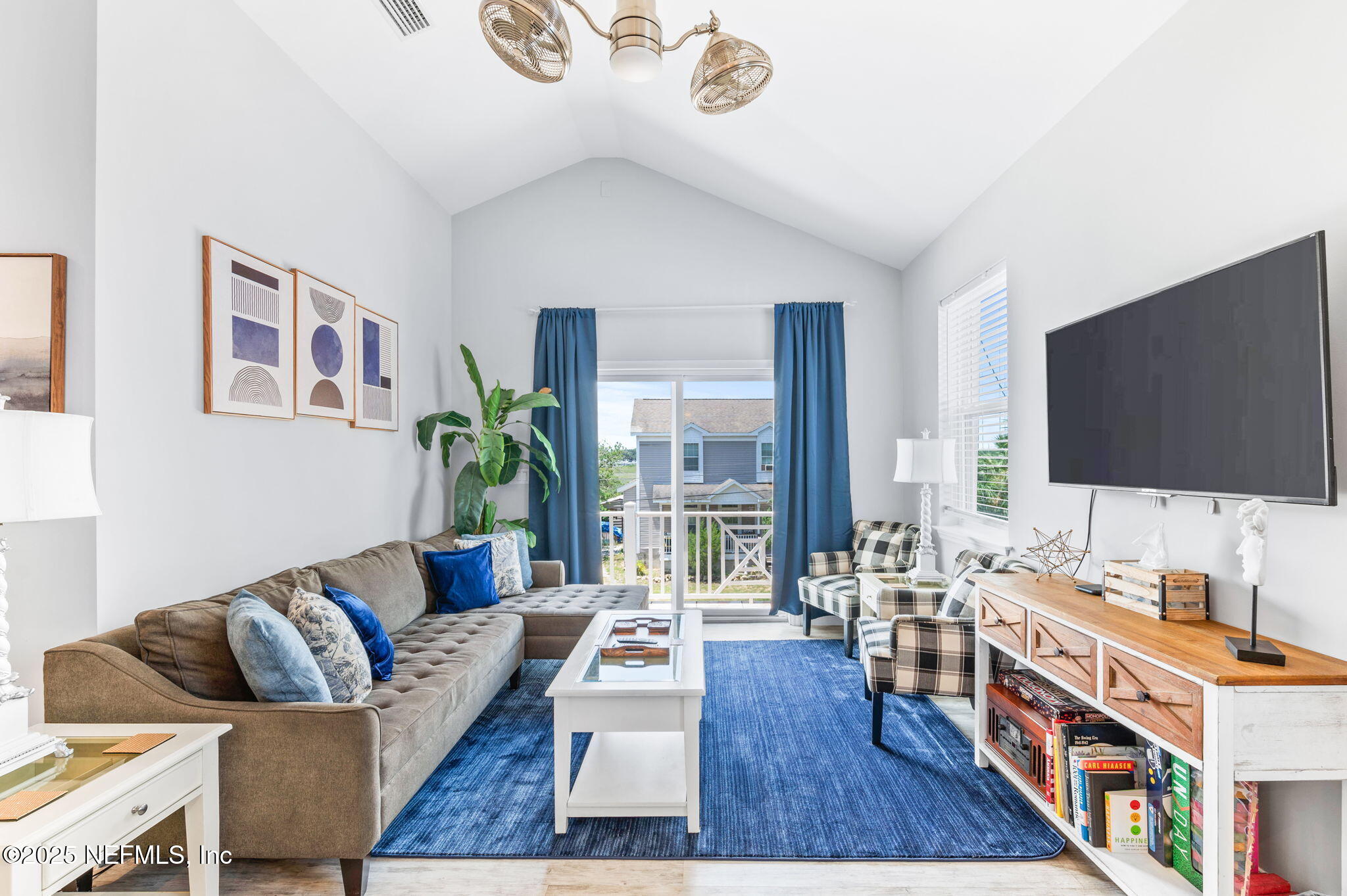 239 Riberia Street St. Augustine, FL 32084 - Photo 4 of 88 a living room with furniture and a flat screen tv