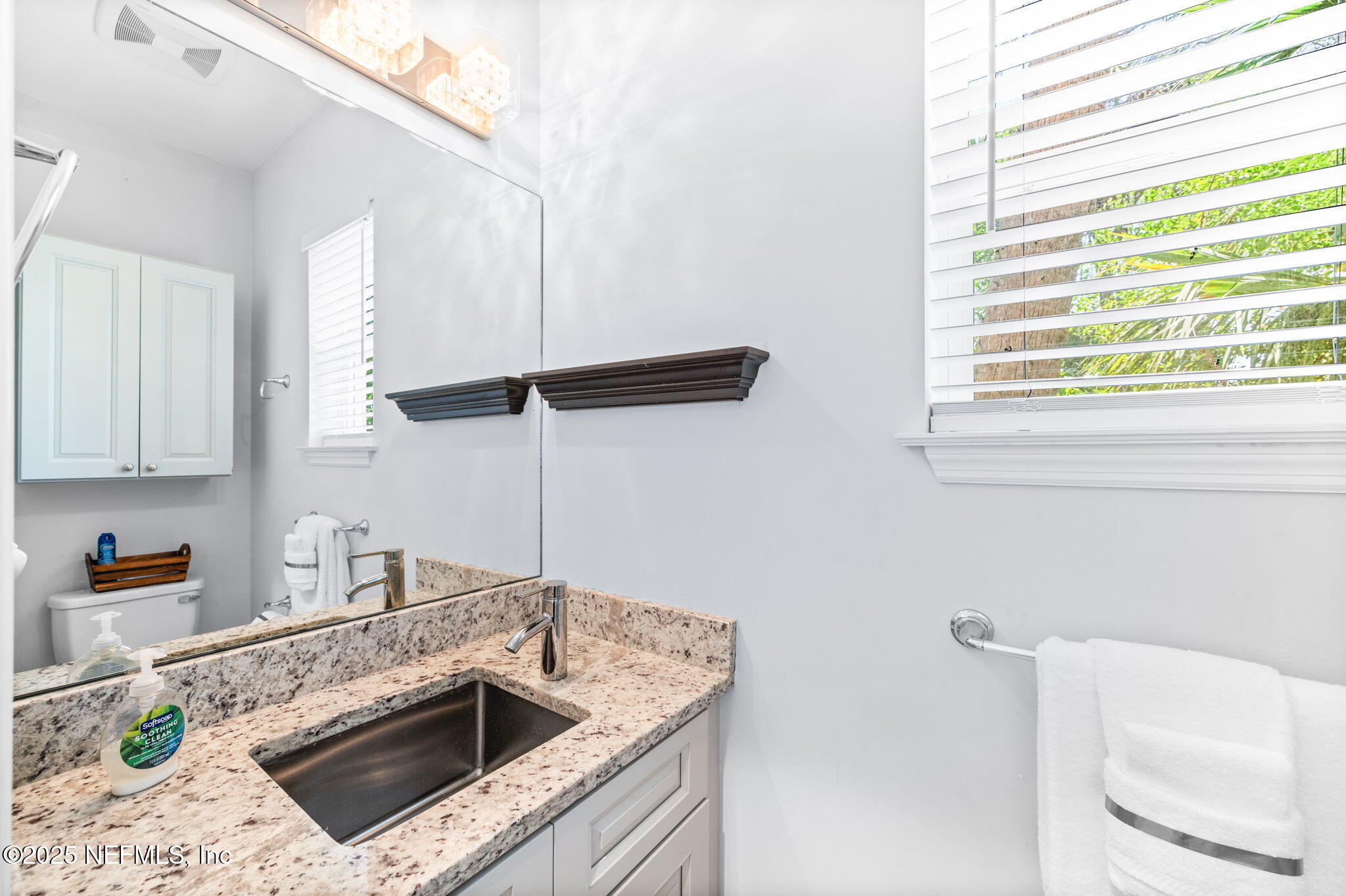 239 Riberia Street St. Augustine, FL 32084 - Photo 43 of 88 a kitchen with a sink a stove and cabinets
