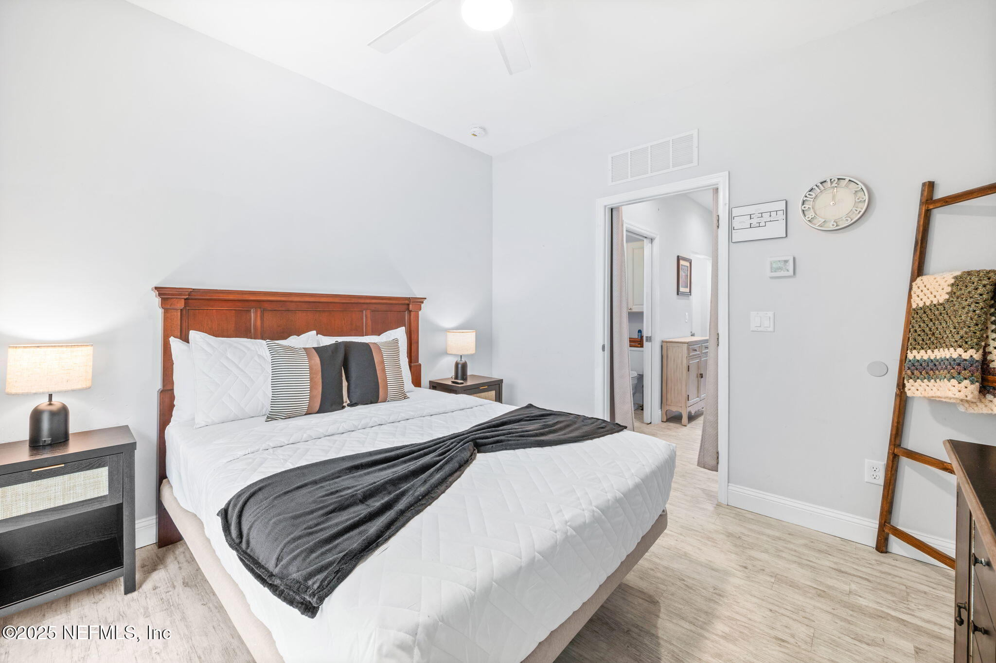 239 Riberia Street St. Augustine, FL 32084 - Photo 51 of 88 a bedroom with a bed and a flat screen tv