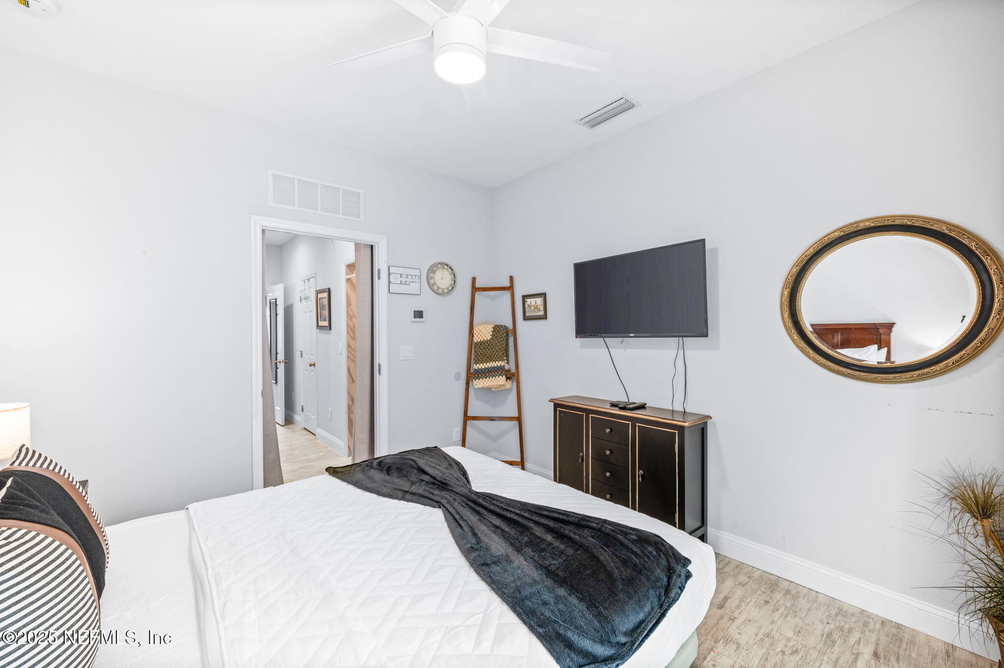 239 Riberia Street St. Augustine, FL 32084 - Photo 52 of 88 a bedroom with a bed and a flat screen tv