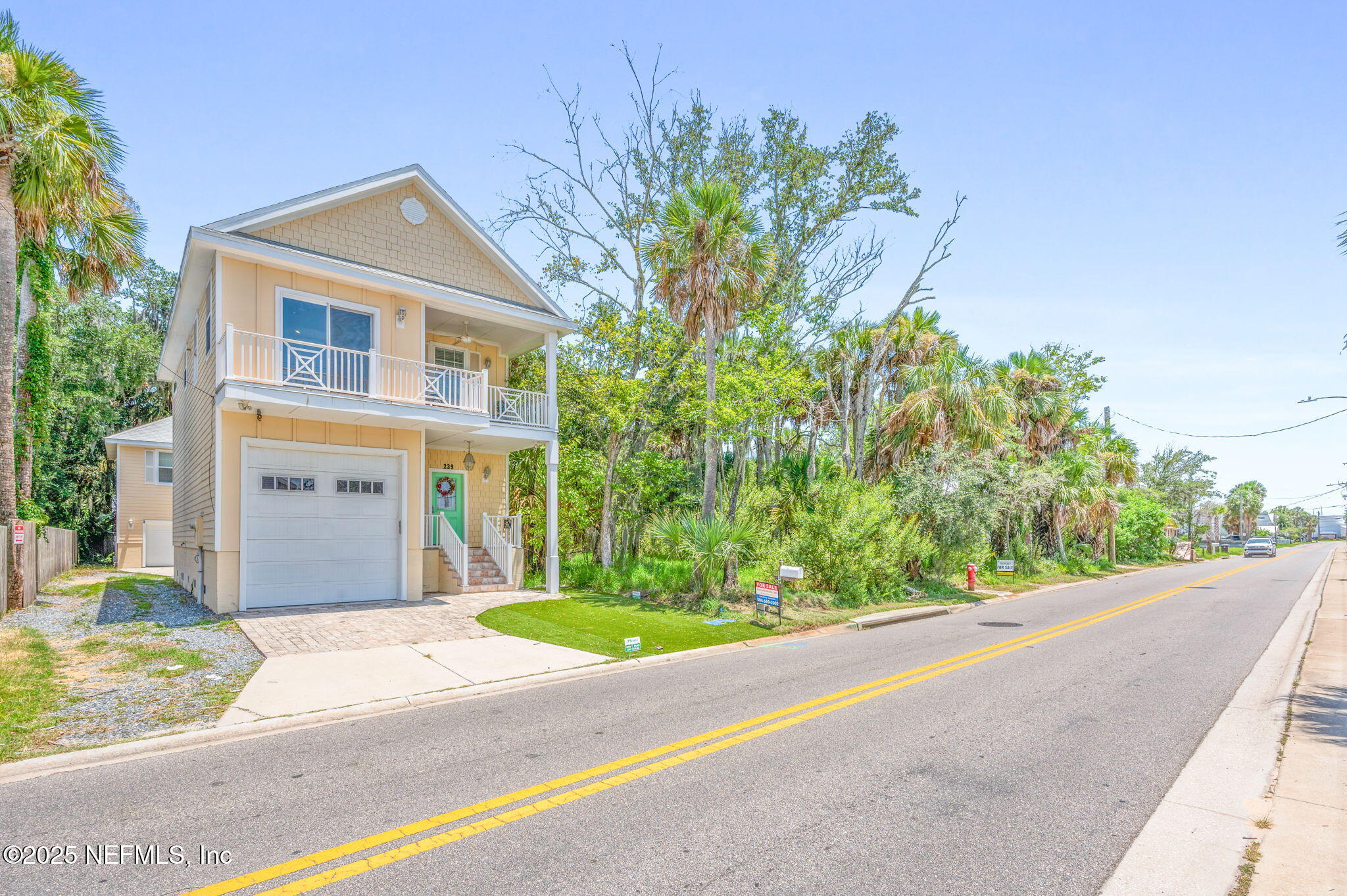 239 Riberia Street St. Augustine, FL 32084 - Photo 57 of 88 a front view of a house with a yard and garage