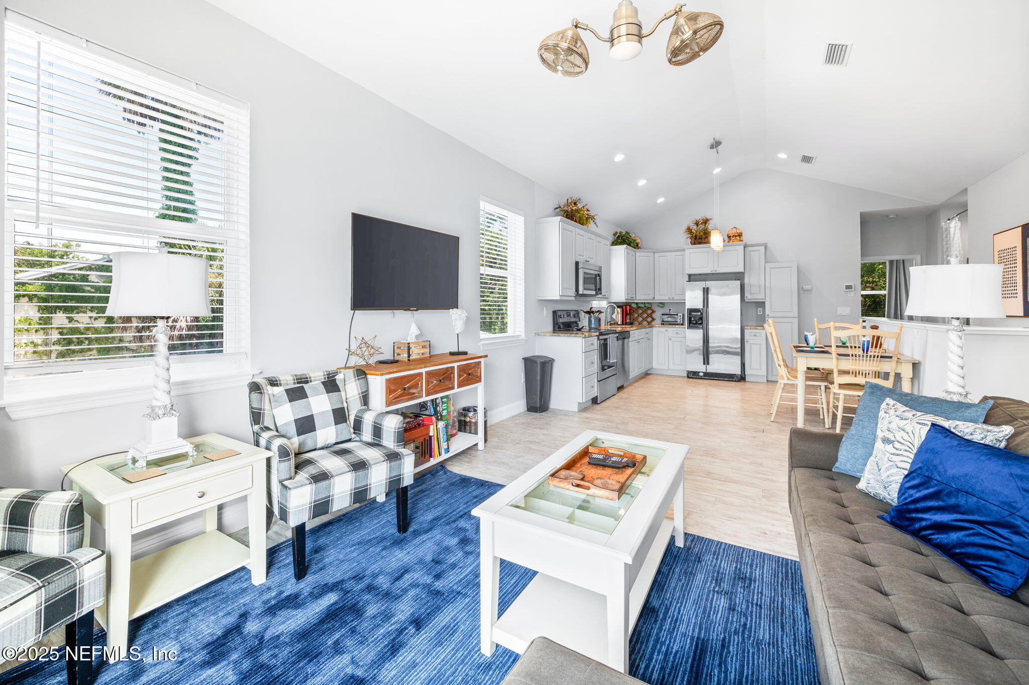 239 Riberia Street St. Augustine, FL 32084 - Photo 6 of 88 a living room with furniture and a flat screen tv