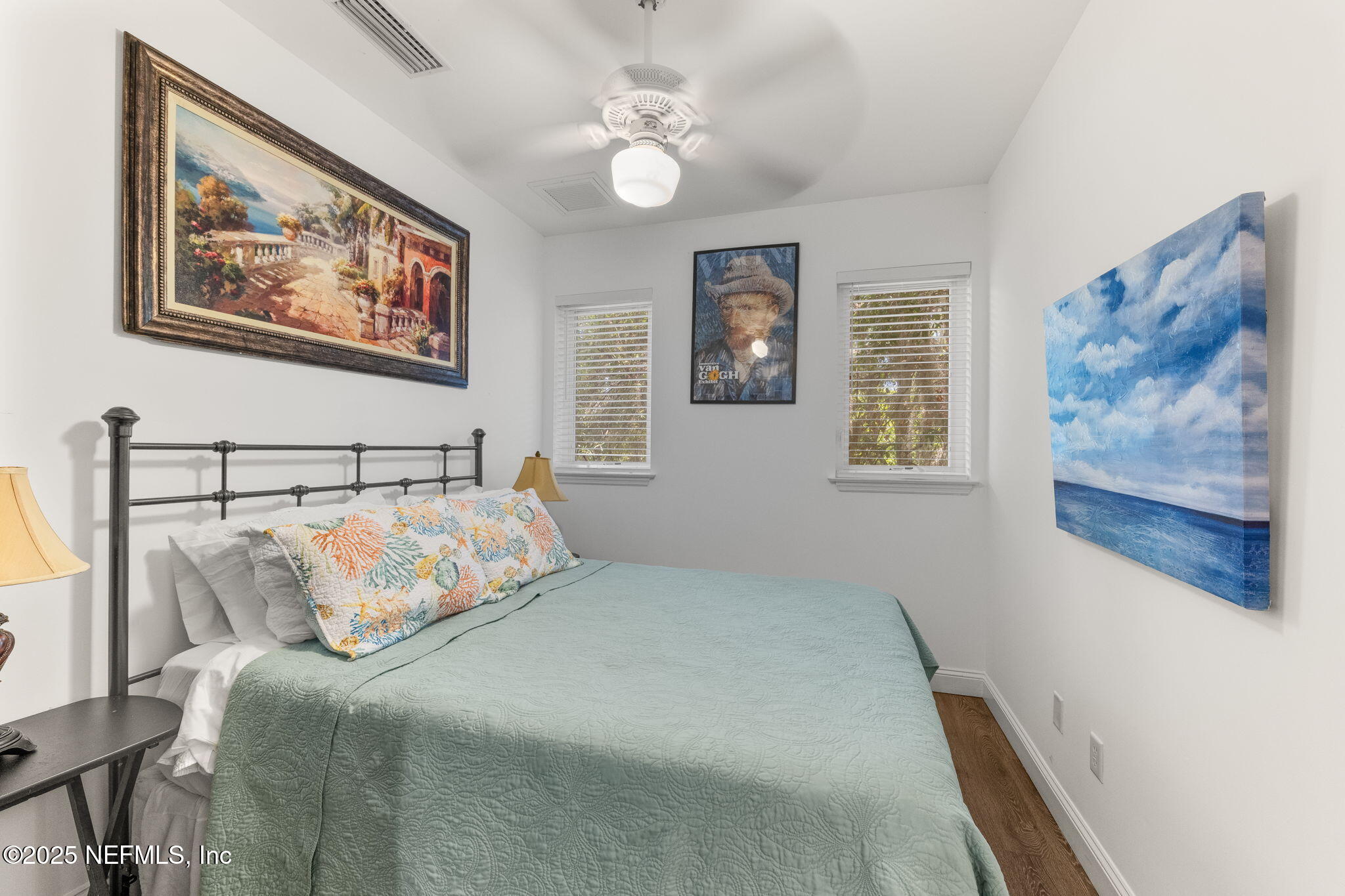 239 Riberia Street St. Augustine, FL 32084 - Photo 68 of 88 a bedroom with bed and painting on the wall