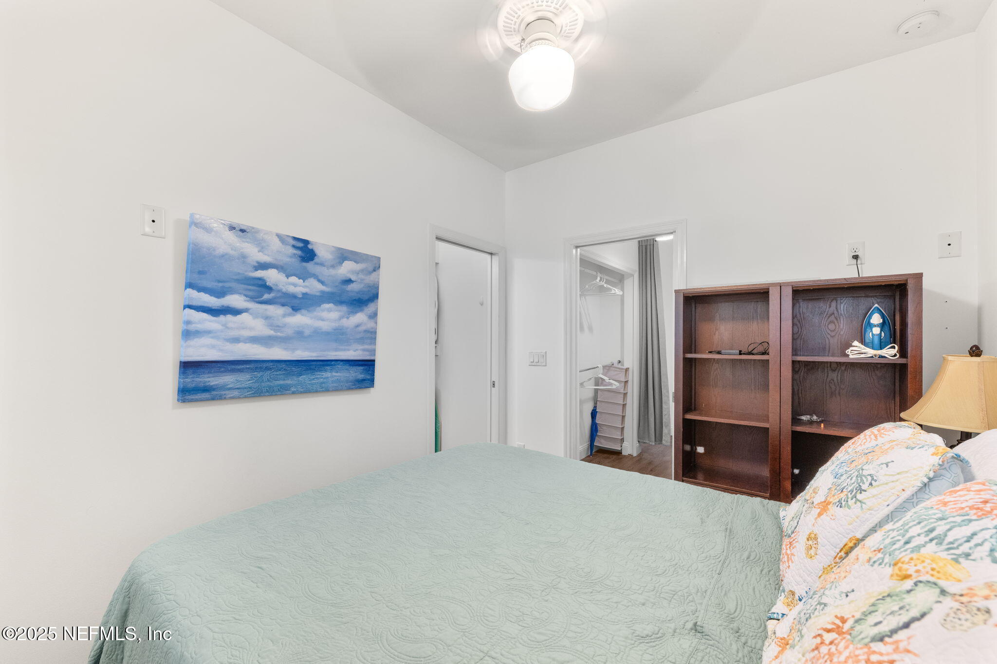 239 Riberia Street St. Augustine, FL 32084 - Photo 69 of 88 a bedroom with a bed and a flat screen tv