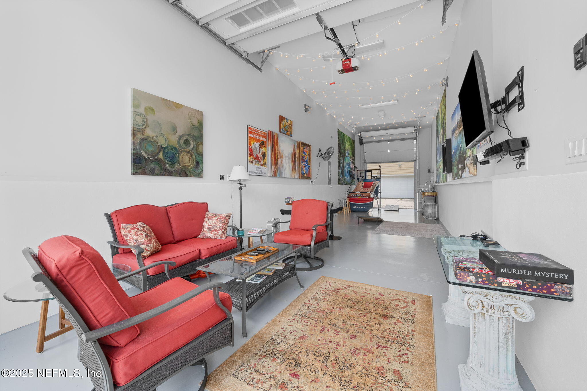 239 Riberia Street St. Augustine, FL 32084 - Photo 76 of 88 a living room with furniture and a flat screen tv