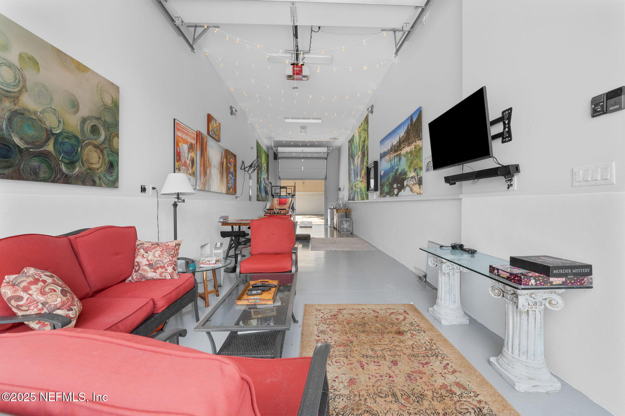 239 Riberia Street St. Augustine, FL 32084 - Photo 78 of 88 a living room with furniture and a flat screen tv