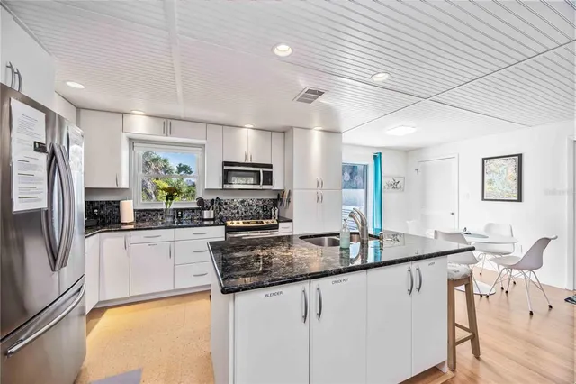 a bedroom with a large bed and a couch