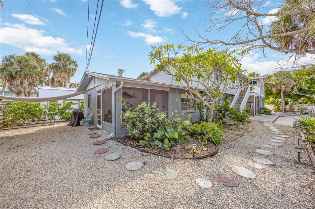 5075 North Beach Road, Unit B4 Englewood, FL 34223 - Photo 21 of 79 a front view of a house with garden