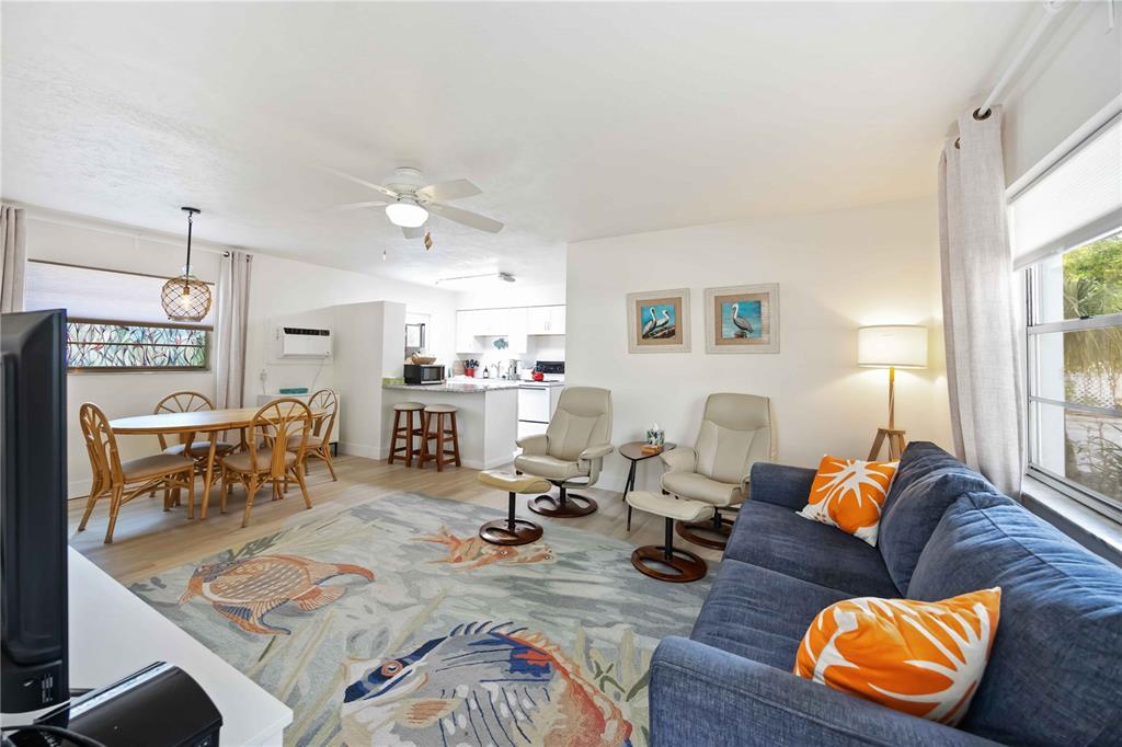 5075 North Beach Road, Unit B4 Englewood, FL 34223 - Photo 23 of 79 a living room with furniture and wooden floor