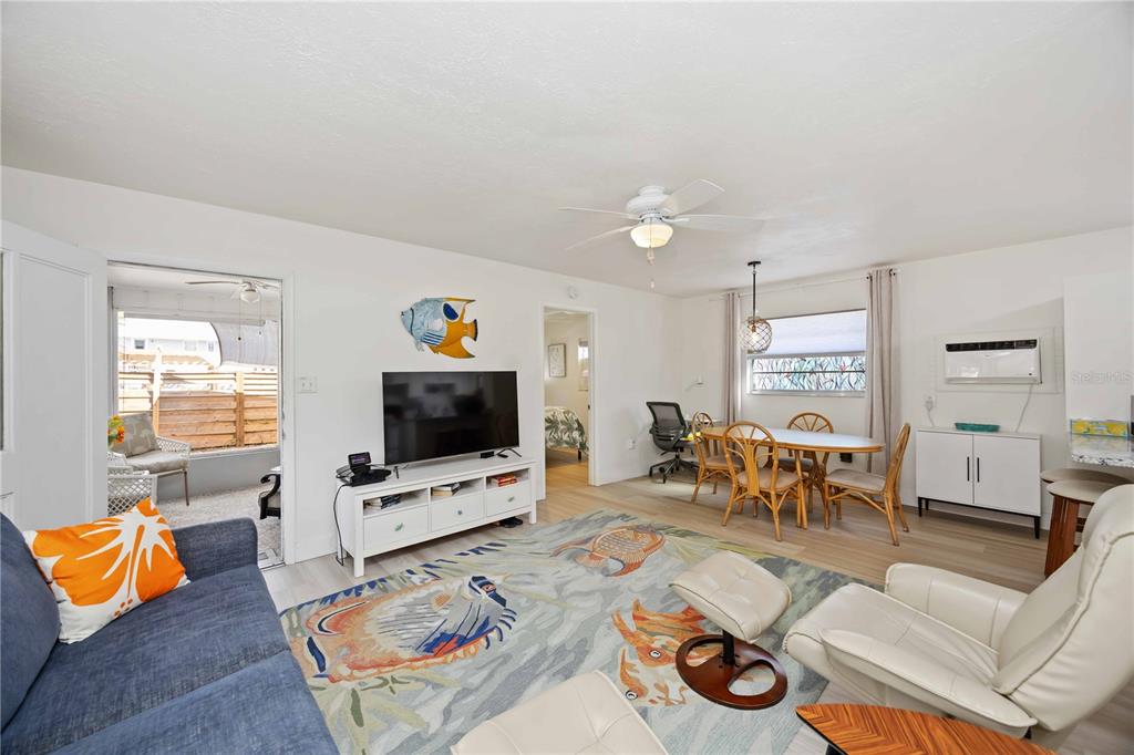 5075 North Beach Road, Unit B4 Englewood, FL 34223 - Photo 24 of 79 a living room with furniture and a flat screen tv