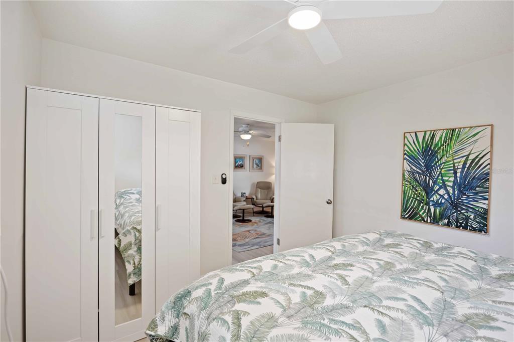 5075 North Beach Road, Unit B4 Englewood, FL 34223 - Photo 29 of 79 a bedroom with a bed and a window